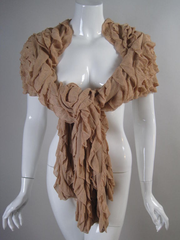 Long wrap from Herve Leger.  Fully covered with pinkish-taupe ruffles.  Unlined.  Measures 81