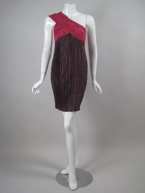 Vintage one-shouldered, pleated cocktail dress from Mary McFadden Couture.  Fitted throughout bust.  Above knee-length.  Side zipper.  Unlined.  Lined only in bust.

No size label.

Measurements-

Bust: 32