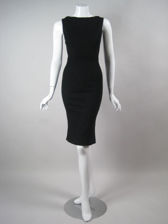 Rudi Gernreich for Walter Bass black stretch wool dress.  Form-fitting.  Sleeveless.  Boat neck.  Side vents.  Fully lined.  Center back zipper.  This dress retailed at the Los Angeles boutique 