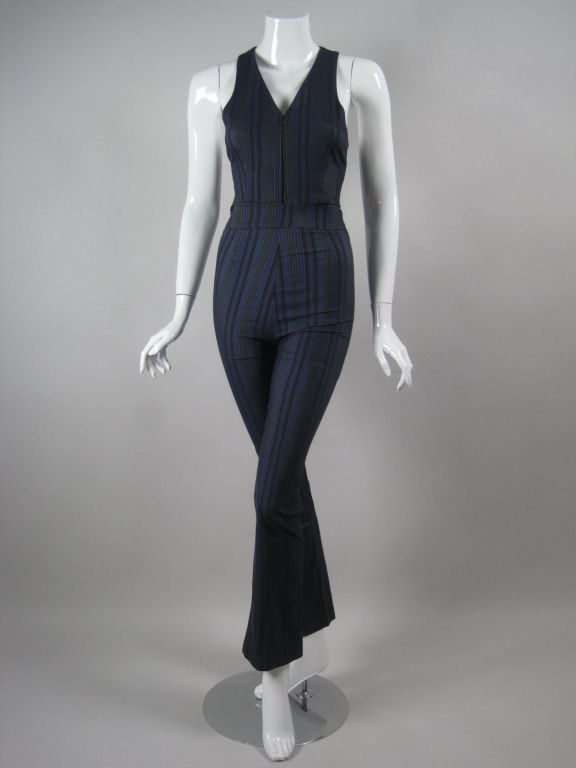 Vest and trousers ensemble from Romeo Gigli.  Blue stretch cotton blend fabric has irregularly spaced grey and narrow white stripes.  Vest has v-neck, zip front, and racer back.  Flat front pants have a flared leg and no pockets.  Both pieces are
