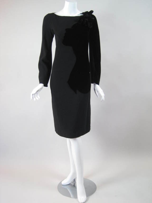 Unique cocktail dress from Sonia Rykiel features a velvet appliqued profile of a woman's face and bust.  Large fabric flower at left neckline looks like an adornment in her hair.  Half of left sleeve is velvet as well.  Boat neck.  Center back