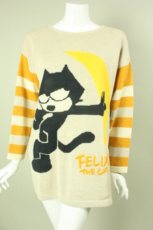 Iconic sweater from Jean-Charles de Castelbajac dates to the 1980's.  It is made of beige cotton and depicts 