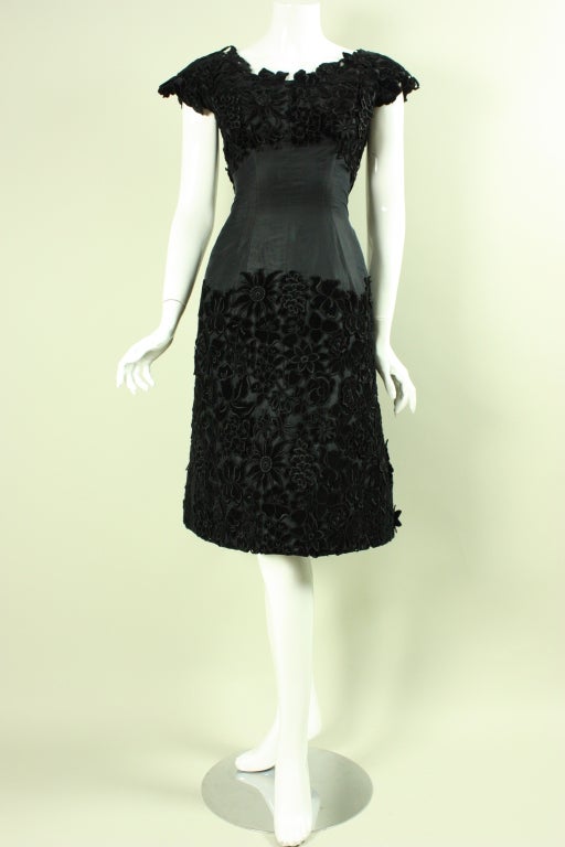 Absolutely lovely cocktail dress from Beverly Hills boutique Maxwell Shieff is made out of black silk taffeta.  The bodice and skirt feature 3-D cut velvet appliques that are densely applied.  Scoop neck.  Cap sleeves.  Full skirt with attached