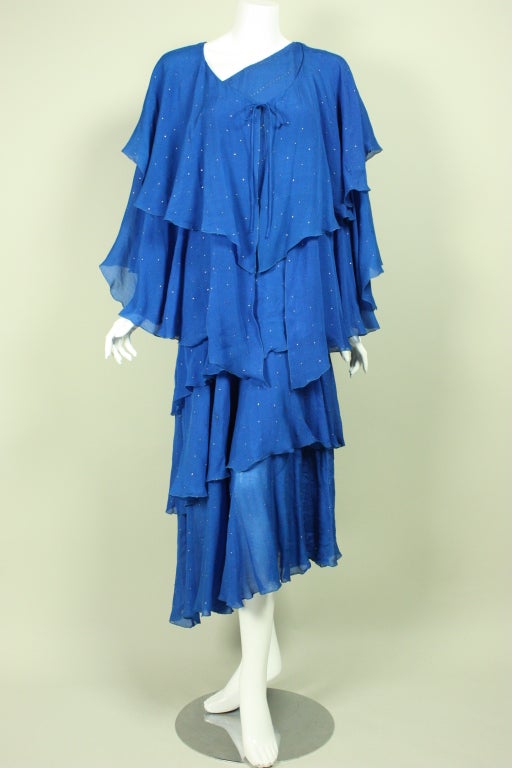 Royal blue silk chiffon tiered dress dates to the late 1970's through mid-1980's.  One-shouldered.  Fully lined.

No size label.

Measurements

Dress-
Bust: 36
