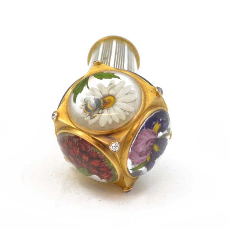 A cane handle, decorated in reverse crystal with various flora signifying love with diamond accents. Features lily of the valley, iris, daisy, violet, carnation and purple lily. In a fitted box marked Paltscho.

Vienna, circa 1890.