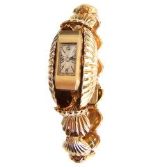 Lady's Gold Scallop-Shell Bracelet Watch with Concealed Dial
