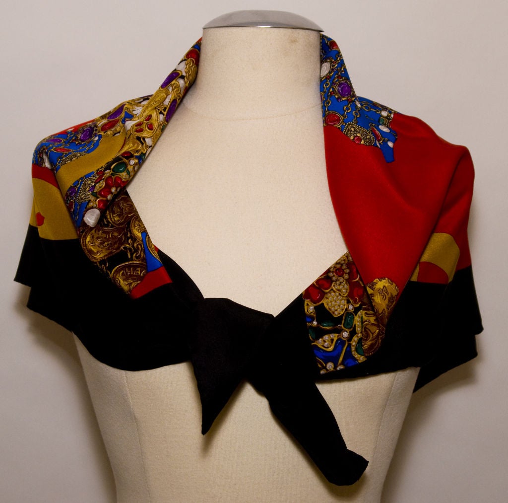 100% Printed  Silk Twill scarf with hand-rolled edges. This scarf represents Chanel's global image as 