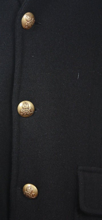 Black 100% Italian Yarn Cashmere Jacket with Black Velvet collar. Brass Lauren Logo buttons on the front and the sleeves. Somewhat formal. This jacket comes with one extra button of each size for the front and the sleeve.