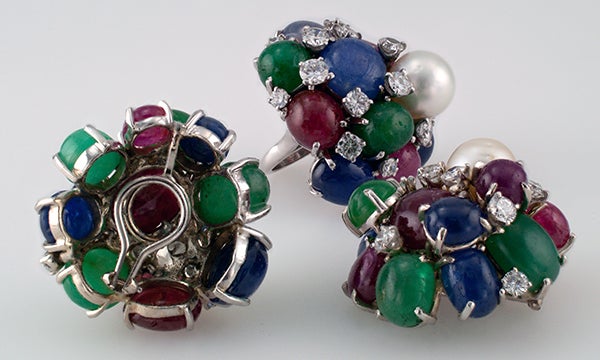 Vintage Tutti Frutti Jewelry Set, Circa 1950
These incredible large scale pieces are comprised of a pair of 
 ear clips and a ring. The bold designs feature a trio of cultured South Sea pearls and a colorful array of cabochon emeralds, rubies and