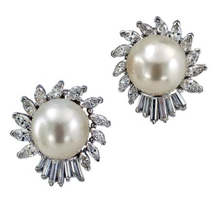 The elegant and sophisticated designs feature four South Sea pearls measuring approximately 13 mm x 12 mm & 13 mm x 12.5 mm respectively, a pair of the pearls framed by marquise and baguette diamonds; the other two capped with round brilliant-cut