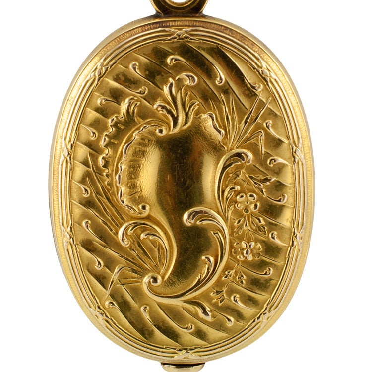 Large French Art Nouveau Gold Locket
This beautiful designed French locket, decorated on both sides by undulating and foliar motifs, extra special, no monogram!, hinged at the top.  Approximately 2 3/4 inches long and 1 1/2+ inches wide. Made in