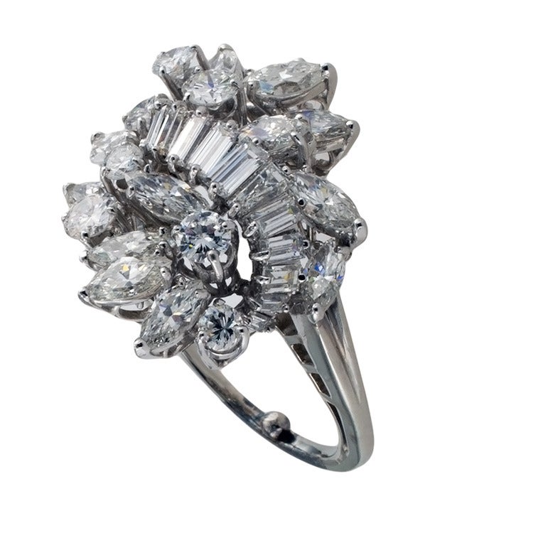 This beautiful cascading design features a shimering array of baguette, marquise and round brilliant-cut diamonds totaling approximately 5.0 carats, mounted in platinum, approximately 1 1/8