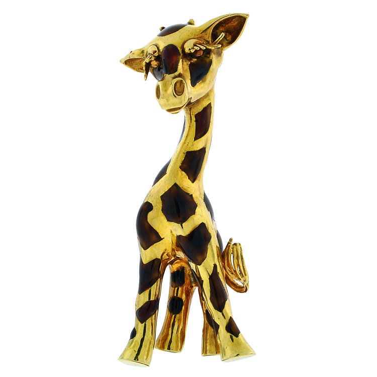 The flirtatious Giraffe features sweeping golden eyelashes and spots in shades of translucent brown enamel and is capable of standing on its four legs.  What a 
beauty!    In 18 Kt gold    2 1/4