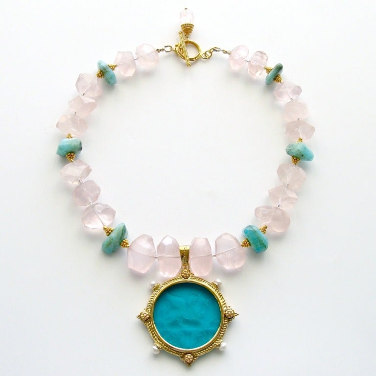 Delicate blush pink faceted rose quartz nuggets have been paired with accents of blue Peruvian opal nuggets to create a stunning backdrop -  complimenting the generous and richly-colored emerald/blue spruce glass intaglio.   This classic Venetian