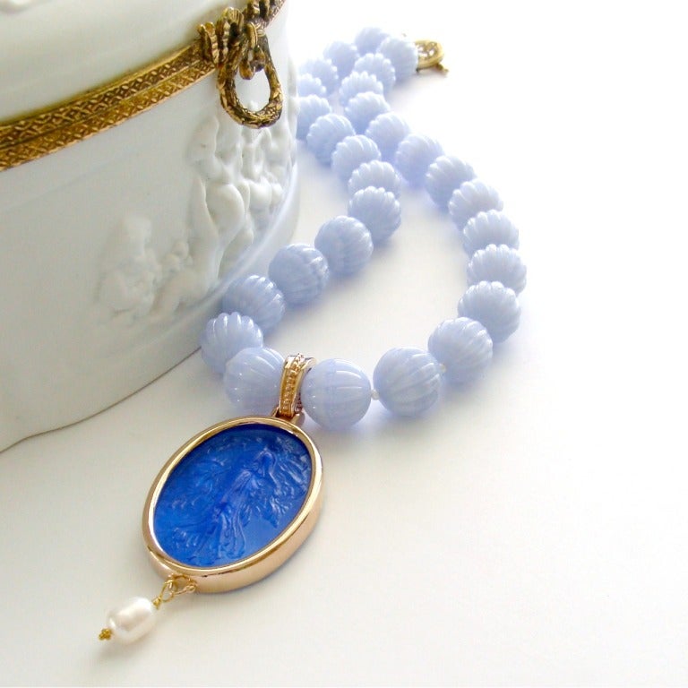 Delicate hand carved fluted periwinkle blue lace agate beads have been paired with  micro freshwater pearls to create a stunning backdrop - complimenting the generous and richly-colored cobalt blue Venetian glass intaglio. This classic Venetian