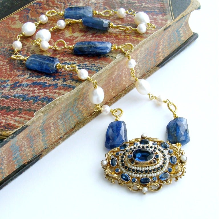 Eliza Necklace - A stunning antique Austro Hungarian sapphire blue paste and pearls brooch has become both the focal point as well as the clasp, for a necklace of hand-coiled kyanite nuggets and freshwater pearls.  This unique design allows the