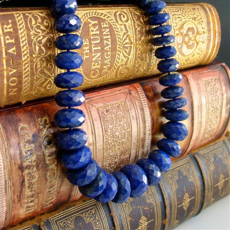 Luxe graduated lapis lazuli faceted rondelles are center stage in this striking and dramatic choker necklace.  These highly coveted large stones are a stunning blue color, sprinkled with little freckles of pyrite and create quite a fashion