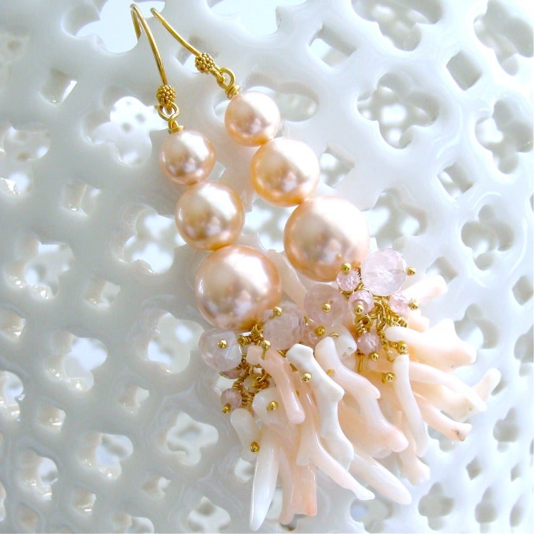 Smooth and silky graduated crystal pearls in a delicate shell pink color explode in a profusion of textural gemstones, while paying homage to the sea.  Soft pink faceted rose quartz onions have been joined with cascading pink spinel tendrils and