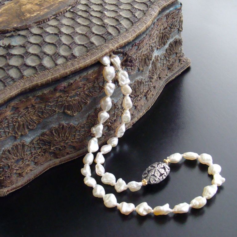Generous, rare and valuable heirloom quality, naturally occurring saltwater keshi pearls, separated with micro pearls, create this classic choker style necklace. Each creamy white/ivory pearl with it’s thick nacre and lustrous silky finish delivers