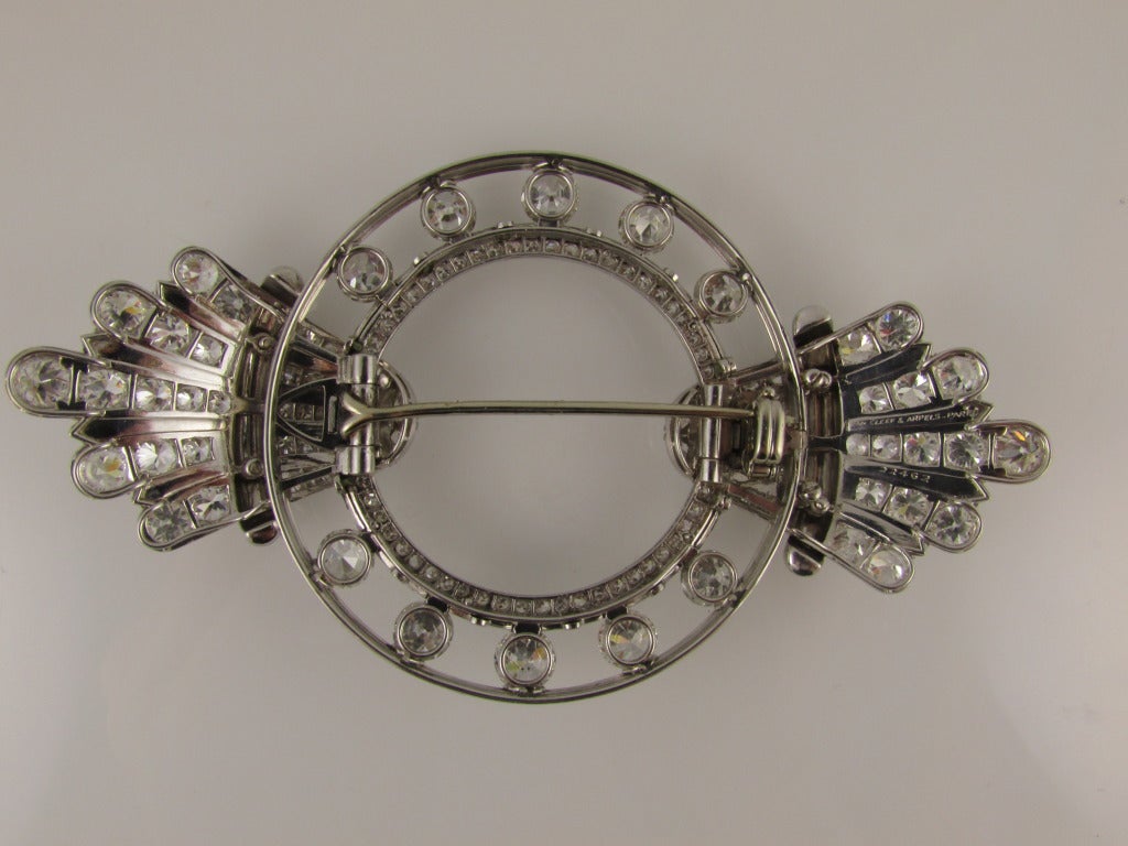 Art Deco platinum and diamond brooch. Total diamond weight is approximately 13.50 carats. 3.5