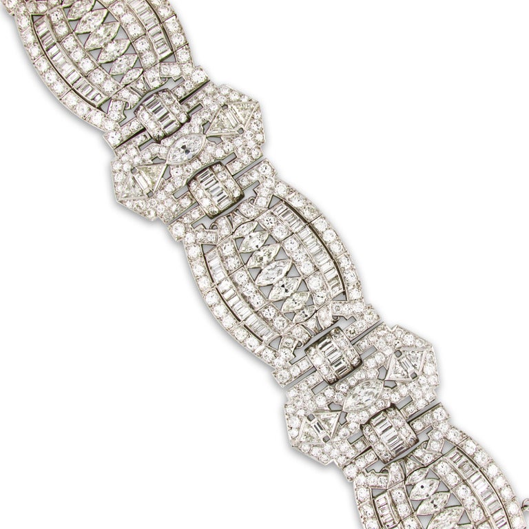 Art Deco platinum and diamond bracelet set with marquise, trillion, baguette and round diamonds. Total diamond weight is approximately 50 carats. 7.5