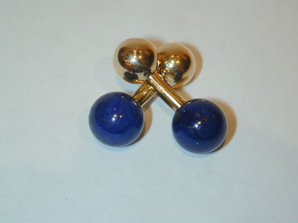 Pair of 14KT yellow gold and lapis lazuli  “dumbbell” cufflinks with straight gold bar connector.  Signed Tiffany & Co