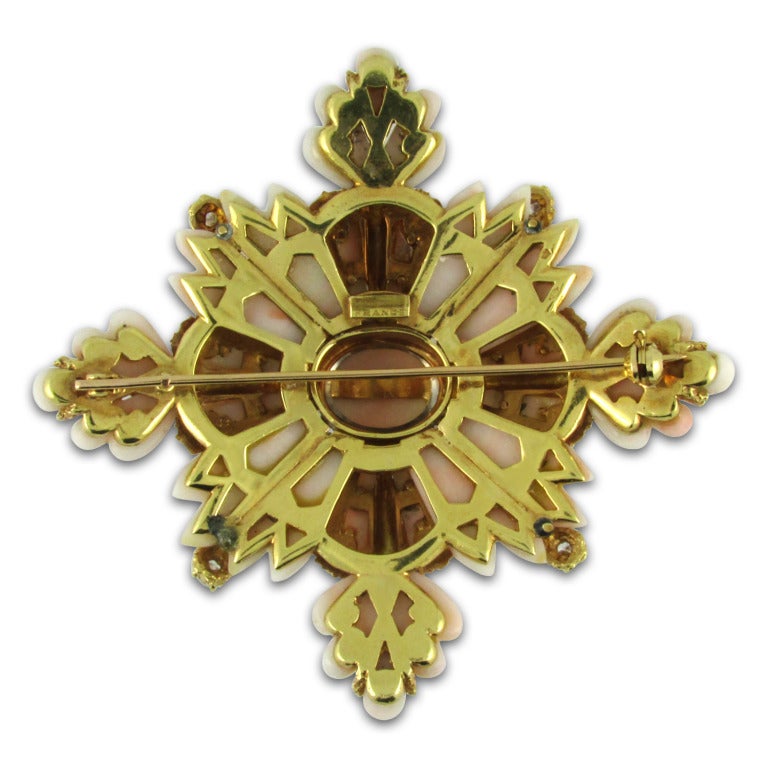 Large textured 18KT yellow gold and light pink coral maltese cross brooch accented with Round Brilliant Cut diamonds. Stamped France with French hallmarks.