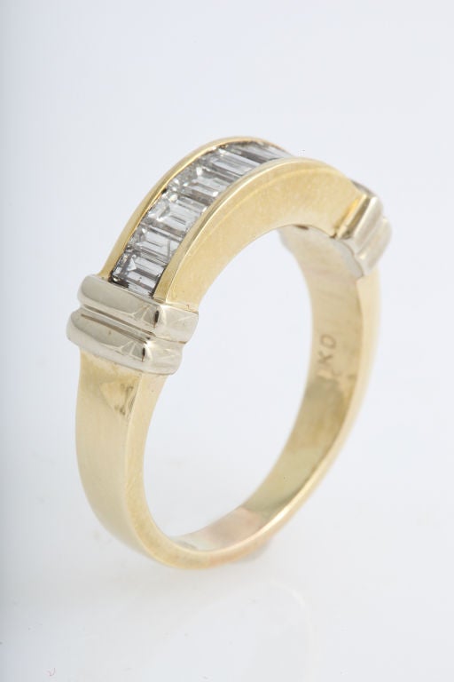 Set with 9 baguette cut diamonds weighing approx. 2.00 carats in a hand made 18K yellow gold mounting weighing 5.40 dwt. <br />
<br />
Ring Size: 9