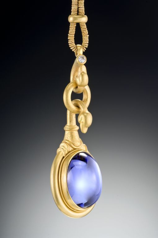 This truly timeless piece is intriguing in its design... The swan is perched above the exceptionally large and perfect Tanzanite cabochon as if protecting it.  I am fascinated by birds and their role in art throughout time and I often use them as