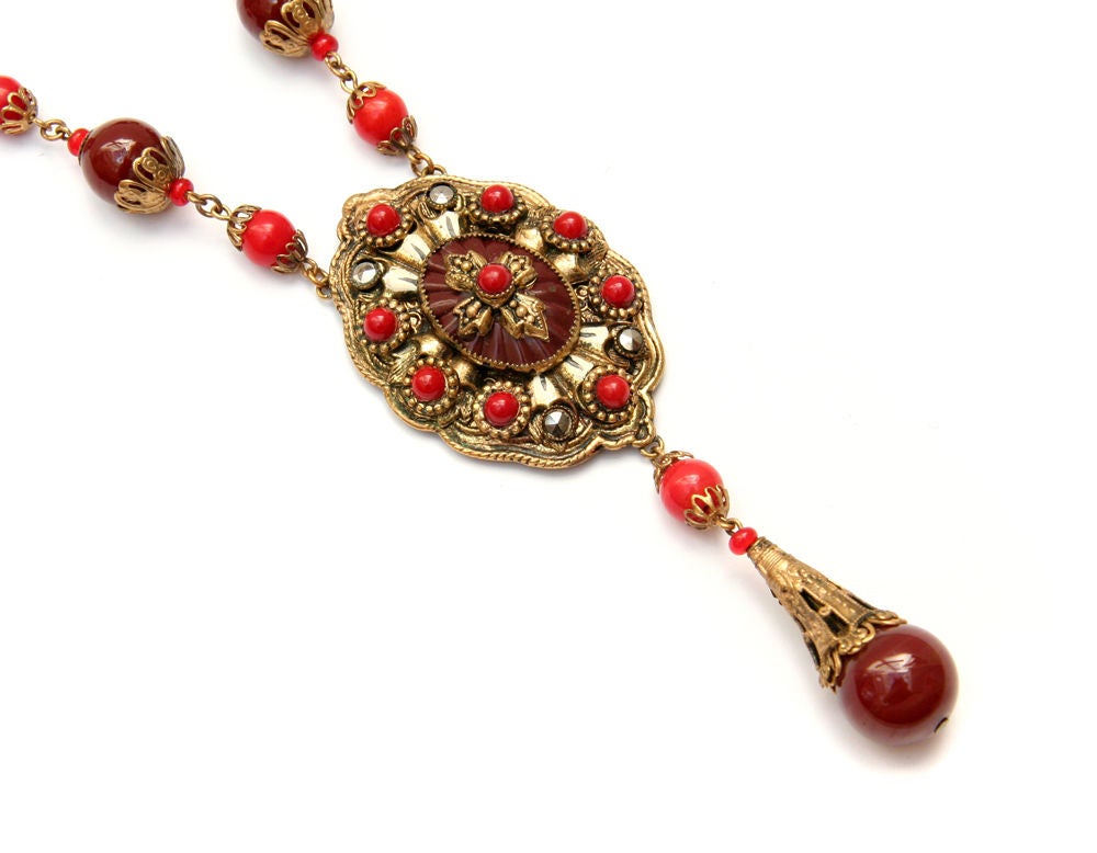 Carnelian and red colored glass beaded necklace with marcasite and enamel accents.
