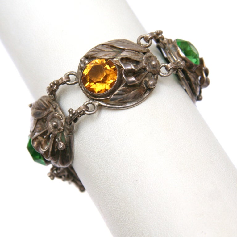 Signed Hobe Sterling bracelet with green and amber faceted crystals.