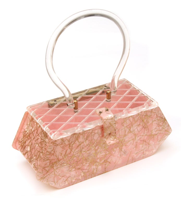 Pearlized pink confetti lucite purse with clear reverse carved lid.