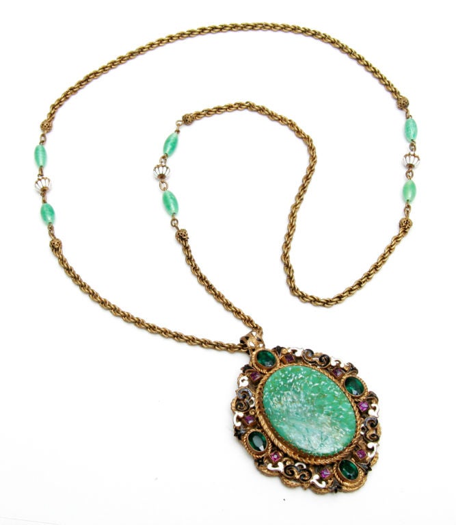 Austro-Hungarian pendant necklace with huge marbleized green glass center stone set in filigree frame.