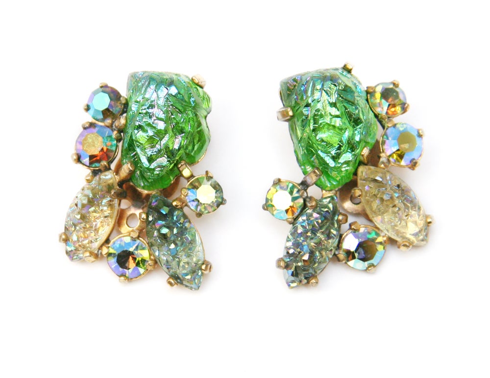 Signed Schiaparelli earrings featuring green, blue, and citrine lava rock stones with blue aurora borealis accents.