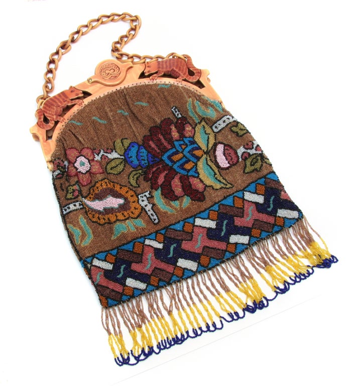 Early 1920's beaded purse with carved celluloid frame.