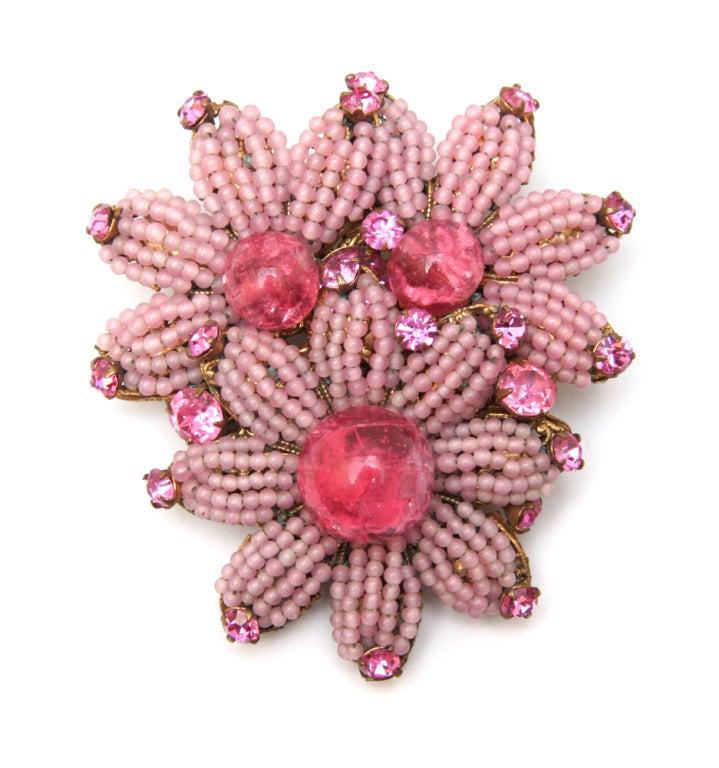 Signed Miriam Haskell brooch and earring set featuring light pink seed beads, large pink crackled glass beads, and pink rhinestones.