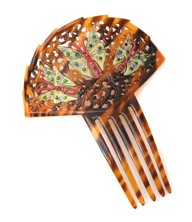 Carved tortoise shell lucite hair-comb with rhinestone and hand painted butterfly motif.