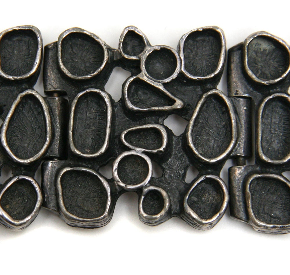 Five link oxidized pewter bracelet by Canadian jewelry designer Robert Larin. Larin produced jewelry in Montreal, Quebec from as early as 1968 and is known for his eclectic modern designs.