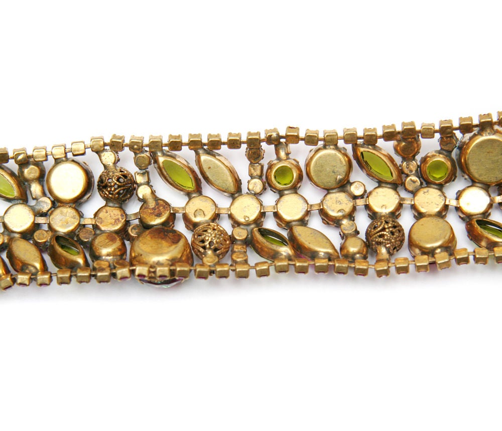 Juliana bracelet with hot pink, peridot and watermelon stones set in gold tone metal.