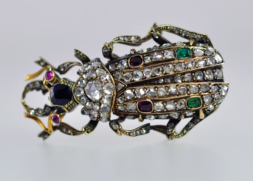 This platinum and gold beetle has so much beautiful detail! He is covered all over with rose cut diamonds, ruby eyes,a sapphire head, and a couple of emeralds and rubies in the wings...just because!  Look at his belly! the detail work even there is