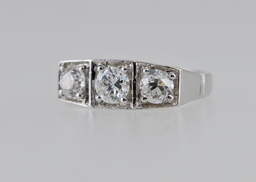 A three-stone Old European Cut diamond and platinum ring from circa 1930s.  The Old European Cut diamonds are 0.48 carats, 0.52 carats, and 0.46 carats and G-H in color and SI2 in clarity.  Makes a beautiful engagement ring or cocktail