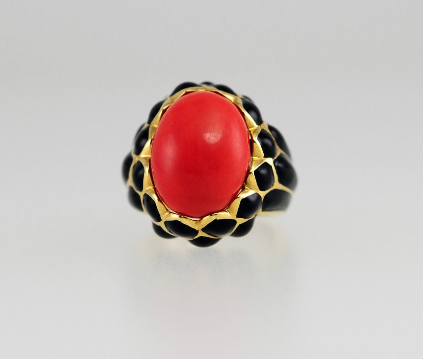 Isn't this chic? It is 18k yellow gold and black enamel ring with a giant coral center, so stylish and signed Webb.  Does it get better?