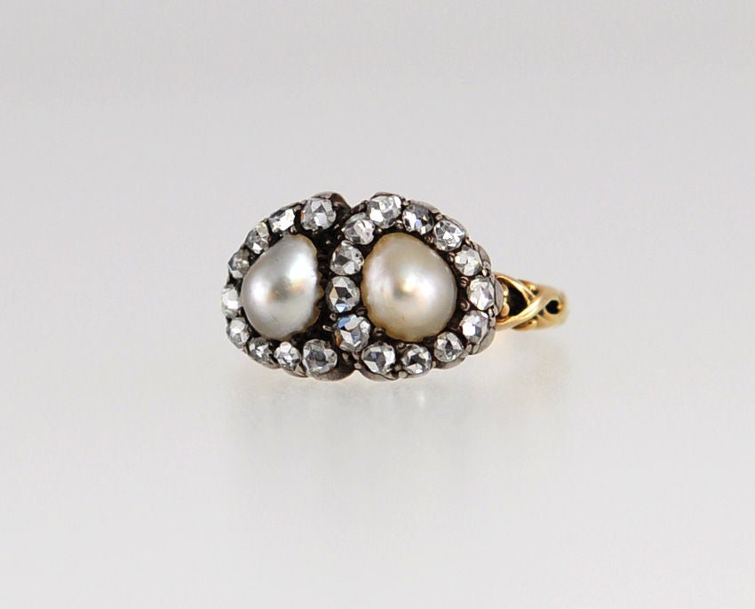Such a romantic and stunning ring!  This sweetheart is made of Silver and 18k gold with rose cut diamonds surrounding a pair of natural pearls...love it!