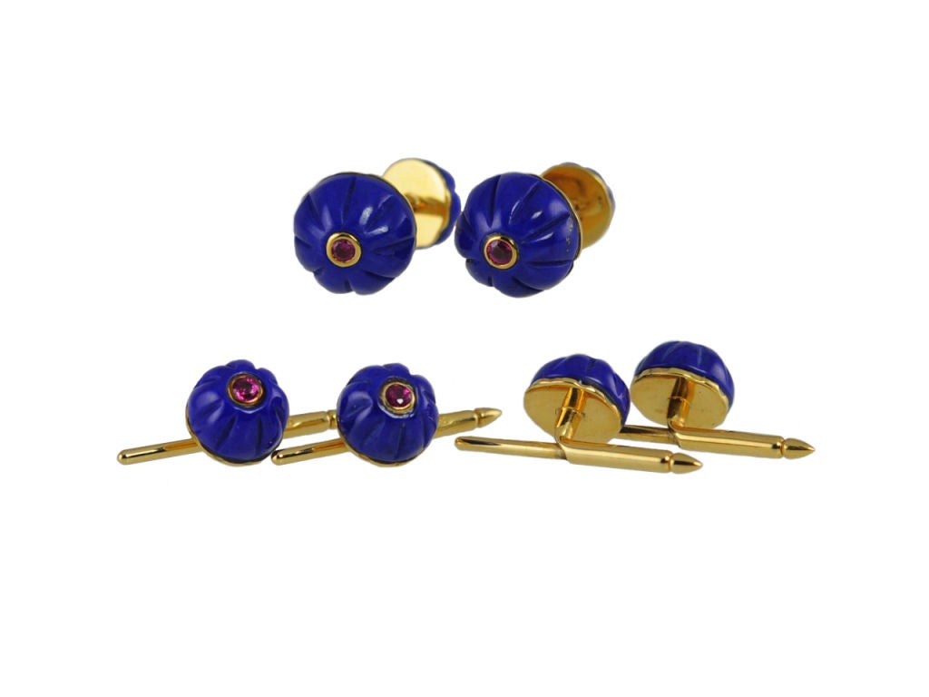 Snazzy Cartier stud set of fluted lapis with a center ruby. Very striking way to snazz up a boring tux, great addition to a collection!