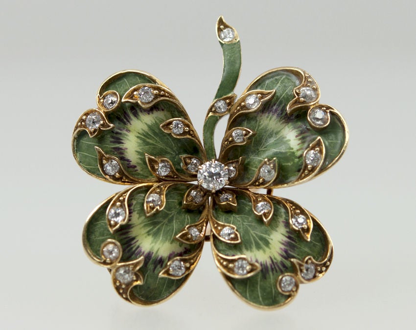 This lucky clover pin has the most gorgeous and realistic enamel ever! It has an old european cut diamond center and numerous diamonds scattered throughout with a total weight of 1ct. This could definitely bring good luck!