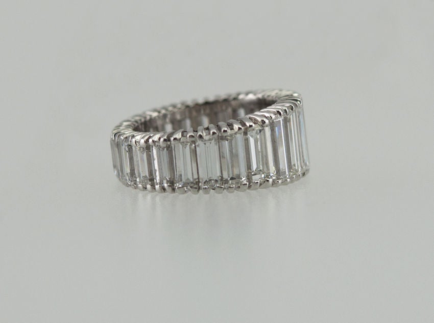 Platinum eternity band with standing baguette diamonds totaling 5cts. They are all G-H VS quality stones, and the ring is a size 4 and cannot be sized up.