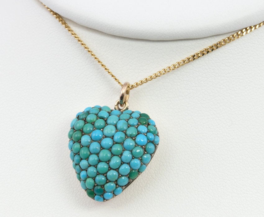 I don't know what it is, but I LOVE a puffy heart anything!  And this is such a great one! 14k gold with an open glass back and the front is covered with turquoise of all diffrent hues. I like the size too, not too big, not too small...just right!