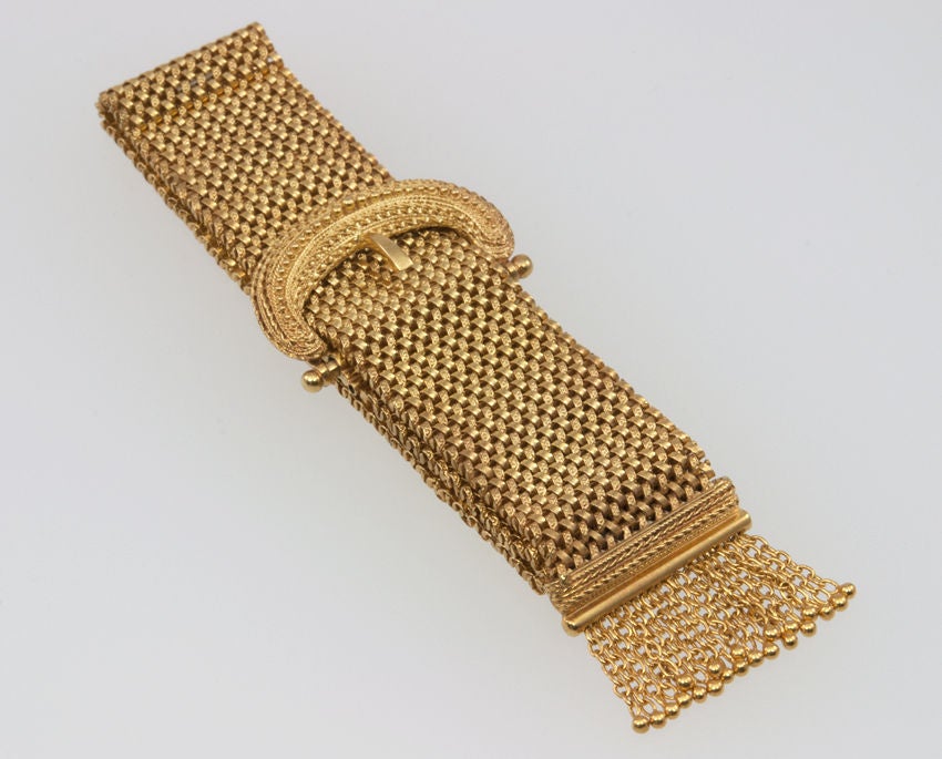 14k gold stunning Etruscan revival mesh tassel buckle bracelet.  It has gorgeous granulation work on the buckle and is in crazy good condition