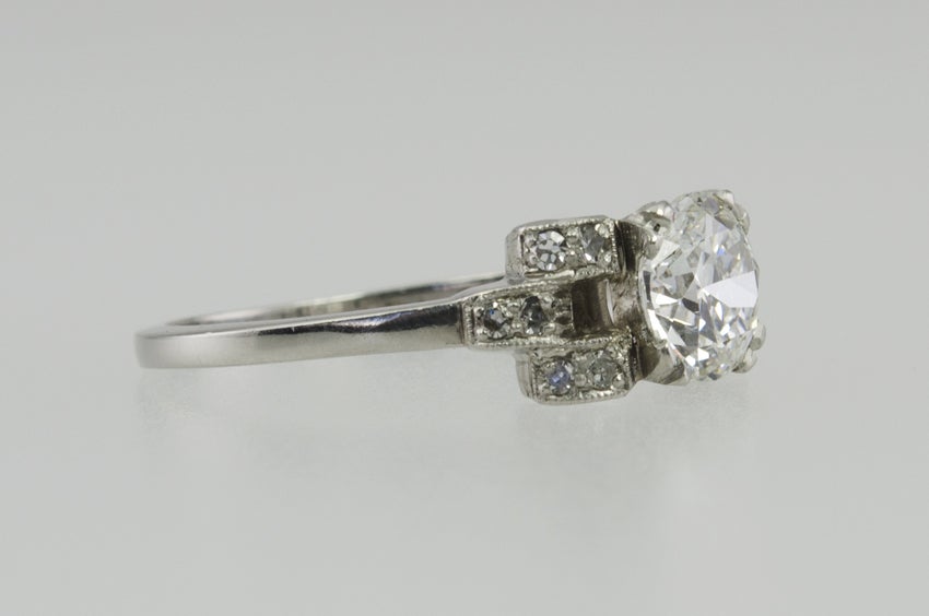 This Beautiful Art Deco ring actually looks better in person than the photograph!  It has really great sides, almost has an Hermes feeling , filled with single cut diamonds.  The center old european cut diamond is 1.06ct. G-SI2 with a GIA