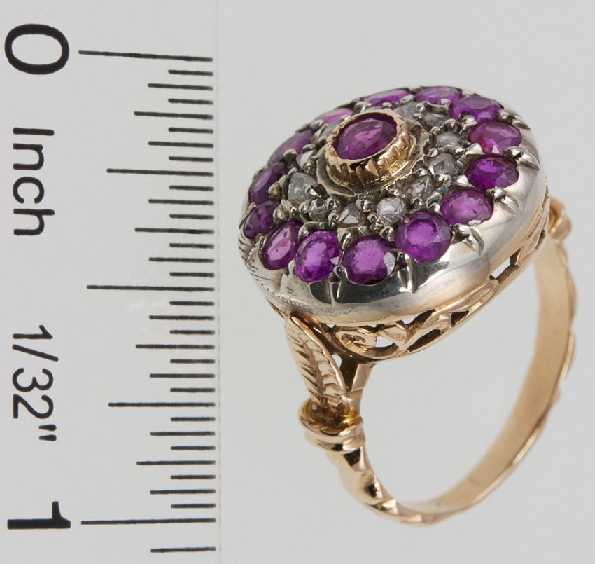 This is an early 20th century reproduction of a 19th century design.  Truth be told, they've been making this same style ring in India for 500 yrs or longer!!  The top is silver, filled with rose cut diamonds and faceted rubies, and the gallery and